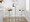 Grotto Contemporary Adjustable Barstool in Chrome Metal, Natural Wood and Brown Faux Leather with Rounded T Footrest — lifestyle photo 3