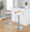Grotto table in Chrome Metal, Zebra Wood, White PU, featuring swivel and adjustable height