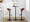 Grotto Contemporary Adjustable Barstool with Swivel in Black Metal, Mahogany Wood and White Faux Leather with Rounded T Footrest- Set of 3 — lifestyle photo 2