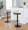 Grotto Contemporary Adjustable Barstool with Swivel in Black Metal, Natural Wood and Grey Faux Leather with Rounded T Footrest- Set of 3 — lifestyle photo 1
