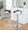 Grotto Contemporary Adjustable Barstool with Swivel in Chrome Metal, Mahogany Wood and White Faux Leather with Rounded T Footrest- Set of 3 — lifestyle photo 1