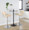 Lombardi Contemporary Adjustable Barstool with Swivel in Chrome Metal, Natural Wood and Cream Faux Leather with Straight T Footrest- Set of 2 — lifestyle photo 1