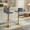 Mara Contemporary Adjustable Barstool with Swivel in Gold Metal and Grey Faux Leather with Rounded T Footrest- Set of 2 — lifestyle photo 1