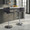 Mara Contemporary Adjustable Barstool with Swivel in Chrome Metal and Black Faux Leather with Rounded T Footrest- Set of 2 — lifestyle photo 2