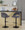 Renee Contemporary Adjustable Barstool with Swivel in Black Metal and Dark Grey Fabric with Round T Footrest- Set of 2 — lifestyle photo 2