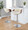 Curvo table in Chrome Metal, Walnut Wood, Cream PU, featuring swivel and adjustable height
