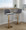 Tintori table in Grey Fabric, Gold Metal, featuring swivel and adjustable height