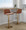 Toriano Contemporary Adjustable Barstool with Swivel in Camel Faux Leather and Gold Metal with Rounded T Footrest- Set of 2 — lifestyle photo 2