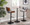 Pebble Mid-Century Modern Table Adjusts From Dining To Counter Or Bar in Black Metal and Walnut Wood — lifestyle photo 3