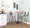 Pebble Mid-Century Modern Table Adjusts From Dining To Counter Or Bar in Black Metal and Walnut Wood — lifestyle photo 5