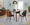 Anabelle Contemporary Dining/Accent Chair in Black Metal, Walnut Wood, and Brown Faux Leather- Set of 2 — lifestyle photo 2