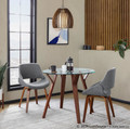 Folia table set in Walnut Wood, Clear Glass, Grey Fabric, featuring glass design and fabric design