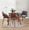 Folia table set in Walnut Wood, Clear Glass, Grey Fabric, lifestyle room setting, featuring glass design and fabric design