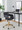 Margarite Contemporary Task Chair in Gold Metal and Black Faux Leather — lifestyle photo 1