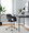 Margarite Contemporary Task Chair in Gold Metal and Black Faux Leather — lifestyle photo 2