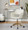 Margarite Contemporary Task Chair in Gold Metal and Cream Faux Leather — lifestyle photo 2