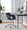 Margarite Contemporary Task Chair in Chrome Metal and Black Faux Leather — lifestyle photo 2