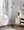 Cone 65" Contemporary Metal Floor Lamp in Plated Nickel with A Black Faux Marble Metal Base — lifestyle photo 1