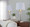 Glacier table in Clear Glass, Brushed Nickel, White Linen, close-up detail, featuring glass design