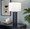 Cosmo 28" Glam Metal Table Lamp in Black Metal and White Linen — lifestyle photo 3