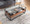 Display Contemporary Coffee Table in Black Metal, Walnut Wood, and Clear Glass — lifestyle photo 4
