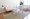 Zenn Contemporary End Table in Stainless Steel and Clear Glass Table Top — lifestyle photo 7