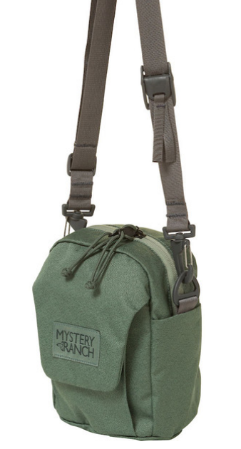 Mystery Ranch Big Bop Canteen/Water Bottle Carrier (Cargo)

Mystery Ranch Big Bop Canteen/Water Bottle Carrier is an essential for every traveler! Originally designed to be worn solely as a shoulder bag, the BIG BOP now expands its options. Shoulder strap, MOLLE attachment to the main pack, or ‘biner it to an attachment point of your choice. The interior shines with simplicity, showcasing a single pocket under the protective flap. A one-handed One Drop quick-adjust shoulder strap lets you dial the pack in, one-handed, and on the fly.
 

Removable one-drop quick-adjust shoulder strap
MOLLE on the back for attaching to belt or loop for carabiner
One interior pocket
Exterior, gusseted front pocket with VELCRO® flap closure.
 330 Robic fabric with YKK Zippers
    