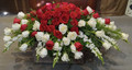 Lush red and white roses and white snapdragons