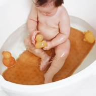 Hevea Bath mat in baby bath