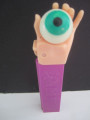 Psychedelic pez Flesh Hand Holding Green Eye,  Pink stem -loose