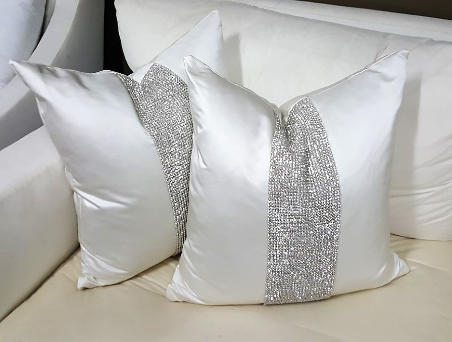 white and silver throw pillows