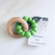 Green wooden silicone teether 