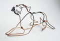 Wire Sculpture of a Border Terrier Lying Down by Bridget Baker