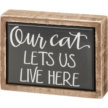 our cat lets us live here box sign