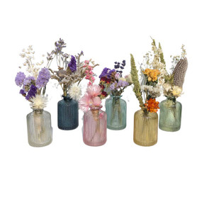 bottle with small bouquet dried flowers set