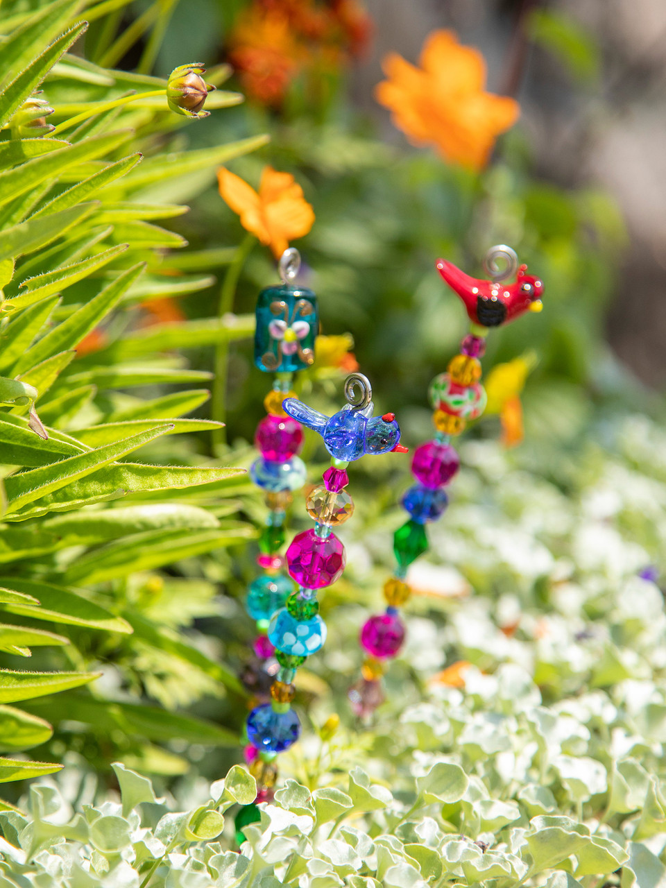 beaded house plant stake (assorted) catching fireflies