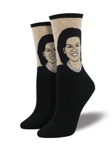 This First Lady is greatly loved, so naturally we designed these Michelle Obama socks in her honor. Improved diet, exercise, and a focus on women’s empowerment across the globe are only a few of the themes we think of when we roll on these First Lady socks. 
Sock size 9-11 fits U.S. women’s shoe size 5-10.5
Fiber Content: 63% Cotton, 34% Nylon, 3% Spandex