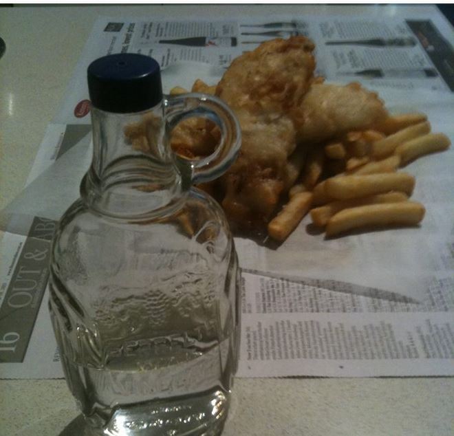 Fish & Chips in newspaper with vinegar