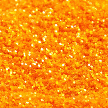 Crystalline Orange Glitter, Semi Transparent and extra sparkly, fine 0.2mm Hexagonal cut polyester cosmetic grade.  Available in easy to apply 15ml Puffer Bottles, 60ml refill bottles or bulk value 250ml bottle.