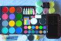 1 x TAG Regular Black 90g & 1 x TAG Regular White 90g, 

1 x TAG Pearl Black 32g & 1 x Pearl White 32g, 

12 x TAG Regular 32g colours in a Professional case - your choice of colours, 

25 x Wicked sponges & 3 x Sponge Mops ,  

1 x Neon Rainbow 50g & 1 x 4 Colour Rainbow 30g, 

5 x Glitter puffer bottles - your choice of colours, 

6 x Brushes-# 1 Round, # 2 Round, # 4 round, # 6 round, # 8 round  & # 12 TAG filbert ( goes with the 30g Rainbow) , 

1 x TAG Neon/Pearl  Palette 12 x 10g  colours   Pearl Purple, Pearl Blue, Pearl Green, Pearl Orange, Pearl Rose, Pearl Gold, Neon Magenta, Neon Purple, Neon Blue, Neon Green, Neon Yellow & Neon Orange,  
                                                                                                                                     
Spray water bottle & Brush wash tub
