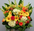 Traditional Sympathy  Arrangement With Bright  Flowers