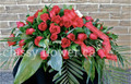 Small size casked spray with red roses 