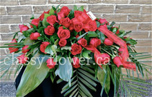Small size casked spray with red roses 