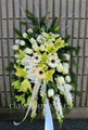 Medium size standing spray with white and cream flowers 