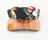 Front view of an aloha fabric visor, black fabric with red flowers