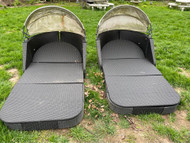 Pair of faux wicker patio lounge chairs with awnings