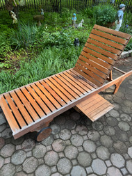 Teak lounger with slide out table by Safavieh