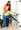 User is wheeled to Support Station, grabs the handholds, and lifts (is lifted) to standing position. When kneeboard is in place (shown in picture), a rolling commode can be moved in. When kneeboard is not used, the Support Station can be pivoted to a standing toilet. Or the client can be diapered with greater ease and better hygiene.