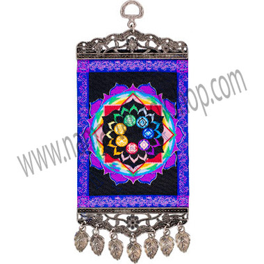 Our vibrant mini-carpet wall charm has been designed with a colorful chakra wheel, which represent the energy centers of the body. Both ends of the carpet have been finished with an intricate antiqued metal frame. The bottom frame also features matching antique metal teardrop tassels.
SYMBOL
The 7 rainbow colors are associated to the chakras and the endocrine system. Violet, crown of the head, pituitary gland is our connection with universal energies. Indigo, middle of forehead, pineal glands represents forgiveness & compassion. Blue, throat, Thyroid gland is our physical & spiritual communication. Green, heart, thymus gland is for love and sense of responsibility. Yellow, solar plexus, adrenal gland represents power and ego. Orange, lower abdomen, pancreas gland is associated with emotion and sexuality. Red, base of the spine, gonads glands represents grounding and survival
- See more at: http://www.kheopsinternational.com/p/Wall-Hanging-Carpet-Chakras/63379.html#sthash.SExdkcUF.dpuf