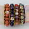 Gemstone & Swarovski Crystal Stretch Bracelets shown in Crystal Dorado Swarovski Crystal, 10mm Sunstone, Light Colorado Topaz Swarovski Crystal, 12mm Amethyst, Olivine Swarovski Crystal, 10mm Multi Fire Agate, Smoked Topaz Swarovski Crystal, 10mm Flowering Jasper, Purple Velvet Swarovski Crystal